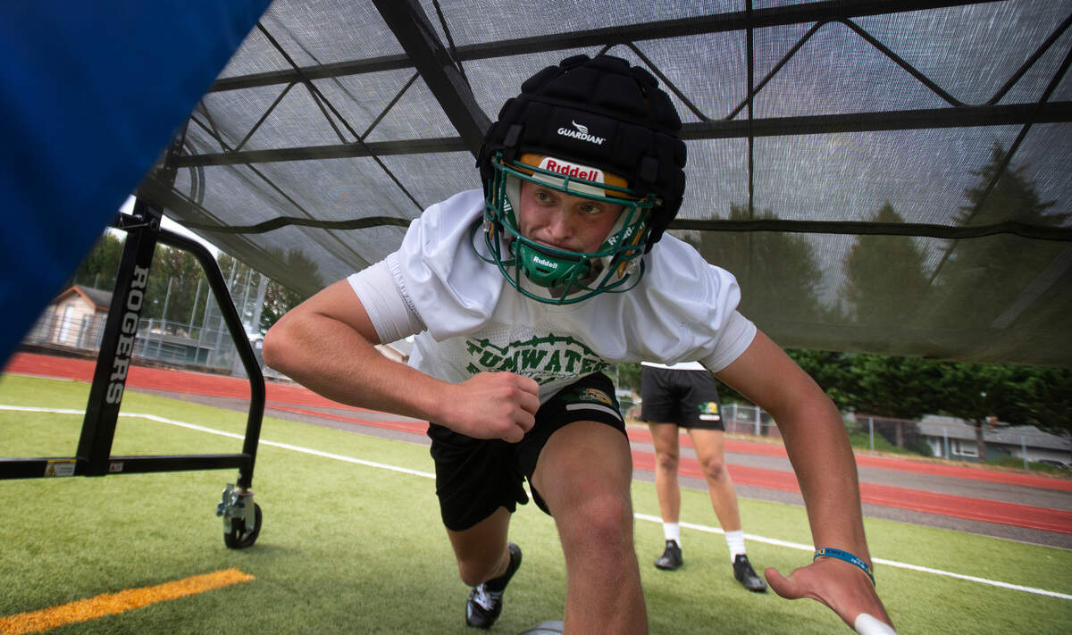 Tumwater linebacker Beckett Wall runs through drills during preseason football practice at Tumwater District Stadium in Tumwater, Washington, on Thursday, Aug. 22, 2024.