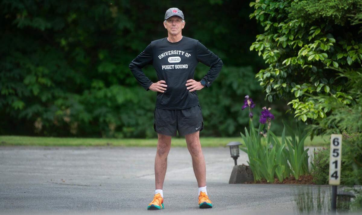 Tacoma native Sam Ring won the inaugural Sound to Narrows run 50 years ago and - as one of the eight remaining “Everytimers” - hasn’t missed a race since. He is shown before a training run outside his home in University Place, Washington on Wednesday, June 8, 2022.