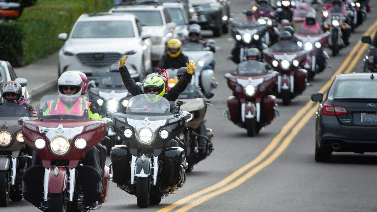 Dozens of motorcyclists clad in pink roared down Harborview Drive as part of the Wigged Out Ride to draw attention to cancer survivors in Gig Harbor on Saturday.