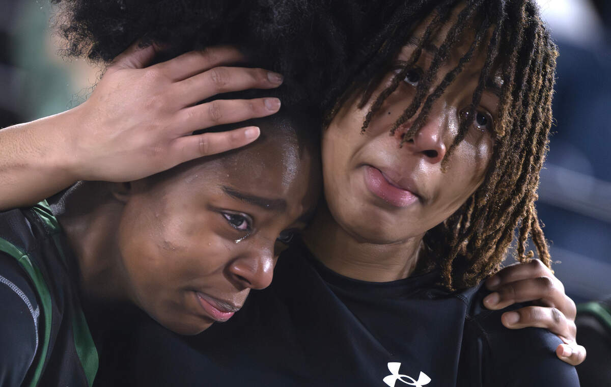 Emerald Ridge’s Saniya Fair is comforted by a teammate as they leave the court following the Jaguars’ season-ending loss to the Bothell Cougars in Wednesday morning’s opening-round game of the 4A girls state basketball tournament in the TacomaDome in Tacoma, Washington, on Wednesday, Feb. 28, 2024.