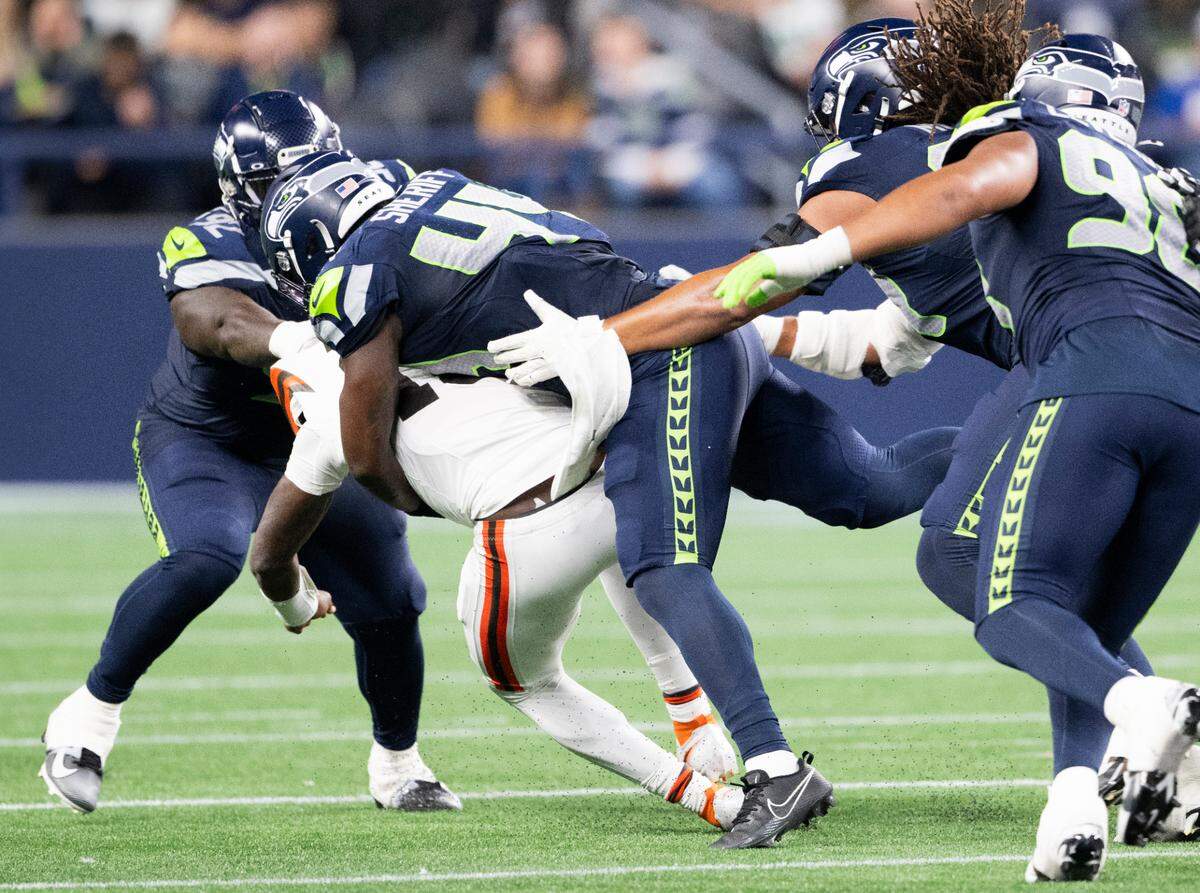 Seattle Seahawks linebacker Jamie Sheriff (44) sacks Cleveland Browns quarterback Tyler Huntley during the fourth quarter of the preseason game at Lumen Field, on Saturday, Aug. 24, 2024 in Seattle, Wash.
