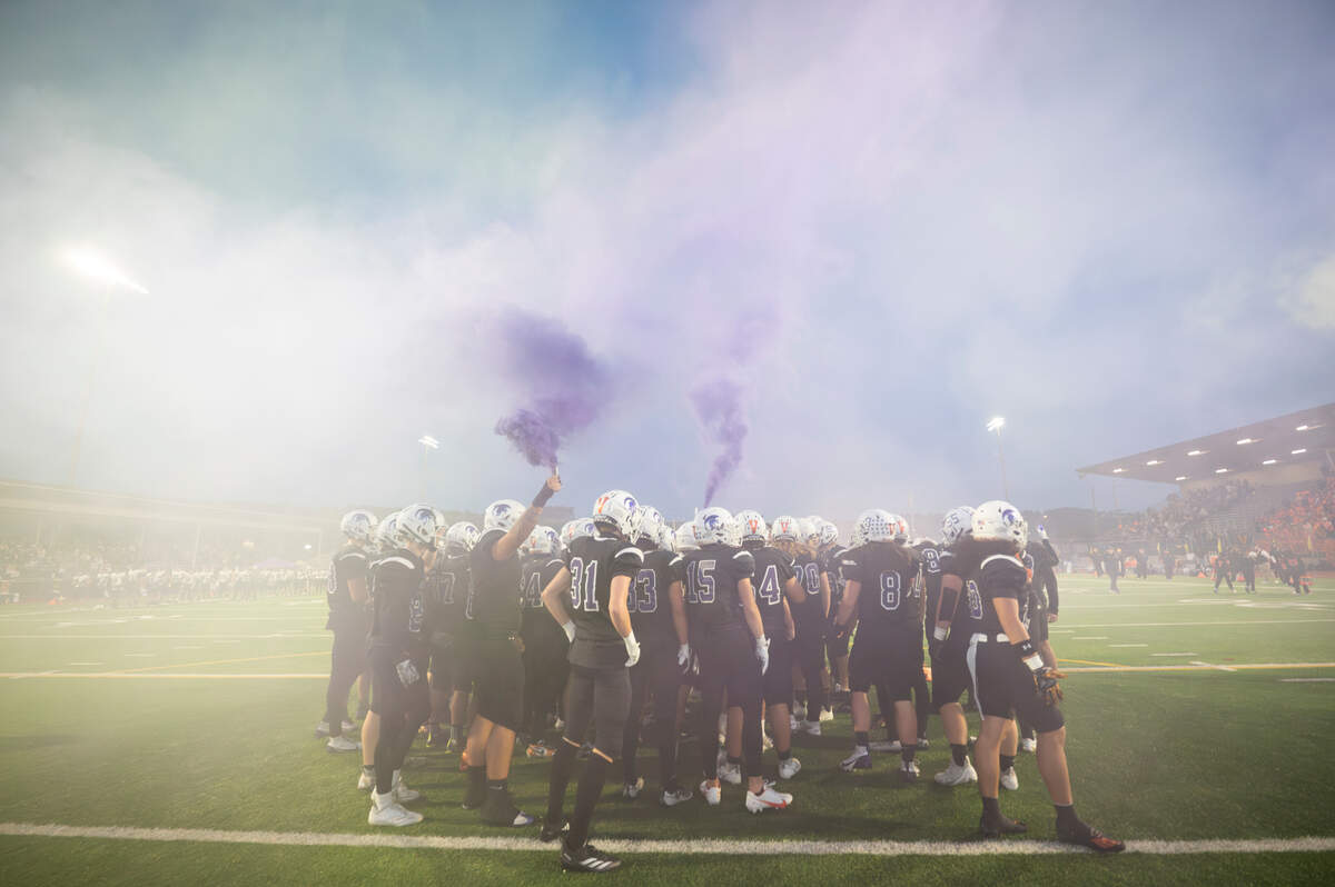 Sumner Spartans huddles before the first half of the game against Puyallup at Sumner High School, on Thursday, Oct. 3, 2024, in Sumner, Wash.