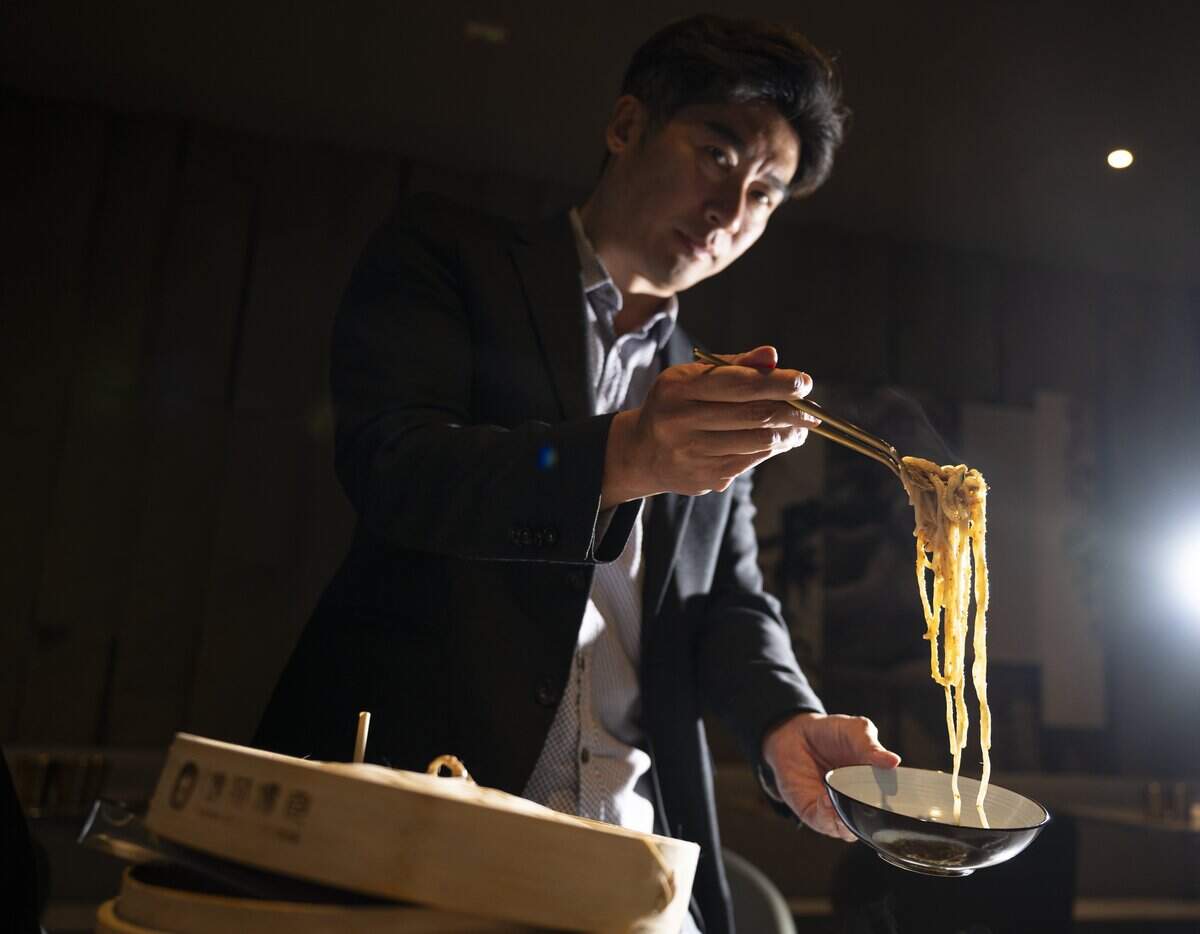Founder Brandon Ting serves up supreme tan tan noodles at Supreme Dumplings on Thursday, June 11, 2026, in Tacoma, Wash.