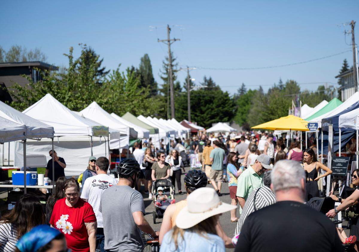 A warm, sunny day brings up to 10,000 people to the Proctor District. On May 11, 2024, crowds picked up local goods for Mother’s Day meals.