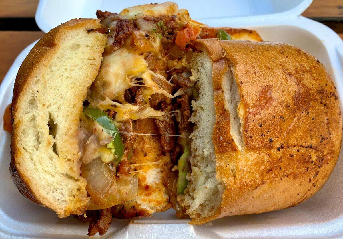 Los Tapatios in Fircrest, Washington, serves a focused menu of Mexican classics with a localized, modern twist. Tequila-marinated steak joins sauteed bell peppers and onions, melted Monterey Jack cheese, refried beans and avocado on a roll that stands up to the task.