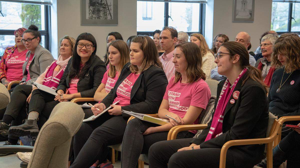 Students from Olympia High School listen to testimony regarding mandatory sexual education during a public hearing on Feb. 13.
