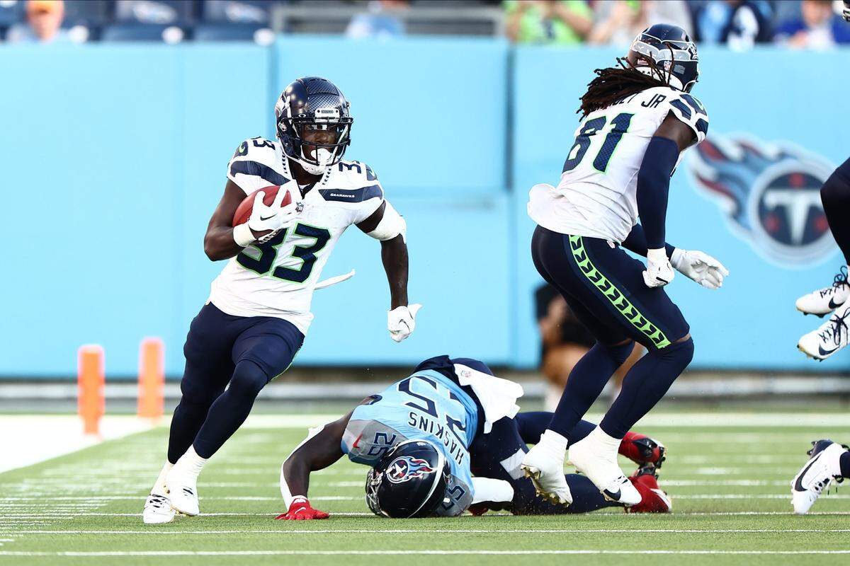 Aug 17, 2024; Nashville, Tennessee, USA; Seattle Seahawks wide receiver Dee Williams (33) runs the ball down the sideline in the first quarter of the game against the Tennessee Titans at Nissan Stadium. Mandatory Credit: Casey Gower-USA TODAY Sports