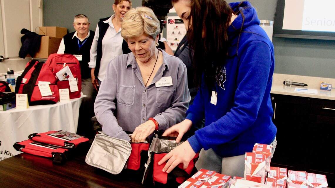 Seniors, high school students bond of over making emergency kits