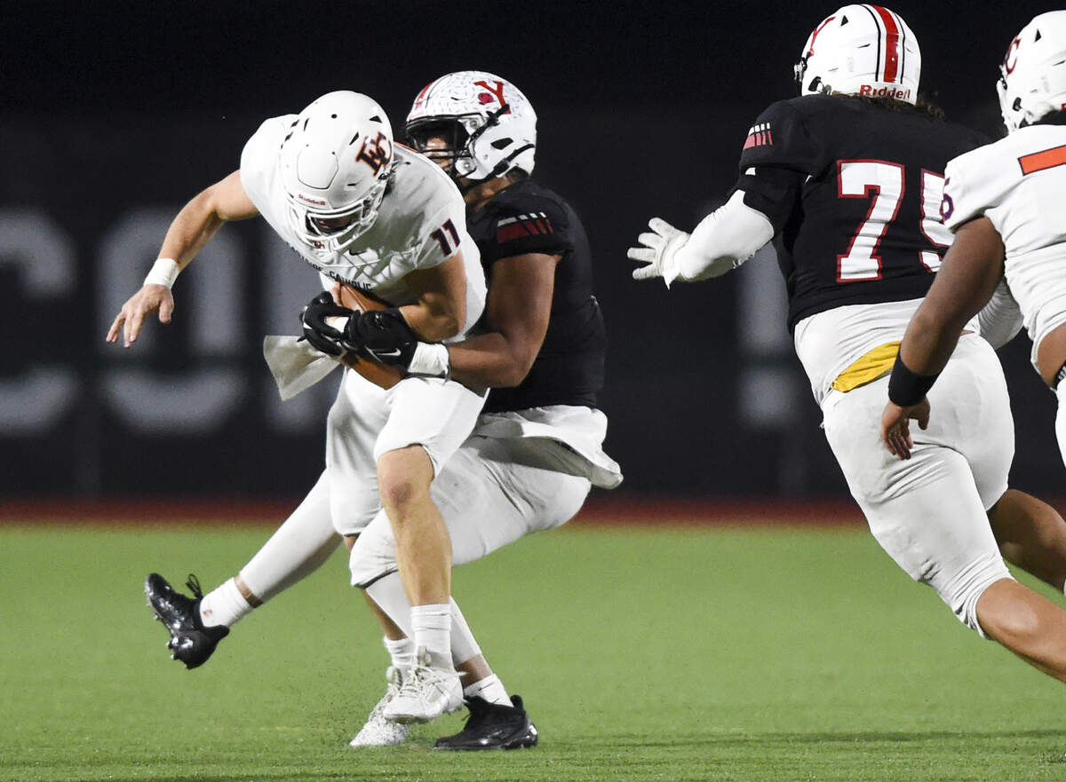 Yelm’s Isaiah Patterson (2) sacks Eastside Catholic’s Jake Tiryakioglu (11) during the first half of the 3A semifinal state game at Art Crate Field, Saturday, Nov. 25, 2023, in Spanaway, Wash.