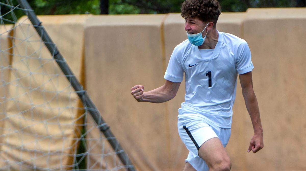 Wilson High forward Abdullah Mousa exults after scoring the Ram’s first, and what proved to be the winning goal, in a 2-0 victory over Stadium High to capture the 3A Pierce County League soccer championship Saturday, May 1, at Stadium High School.