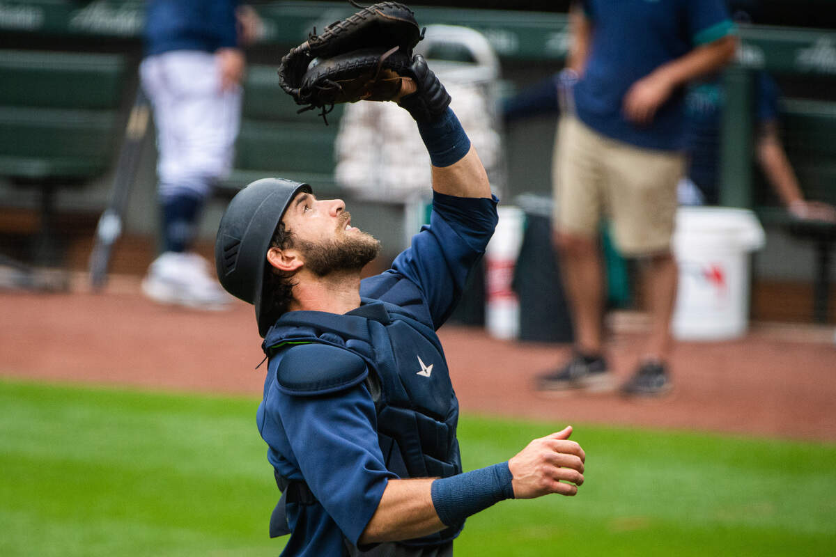 Austin Nola catches a ball during drills at the Seattle Mariners Spring Training at T-Mobile Park in Seattle, Wash., on Friday, July 3, 2020.