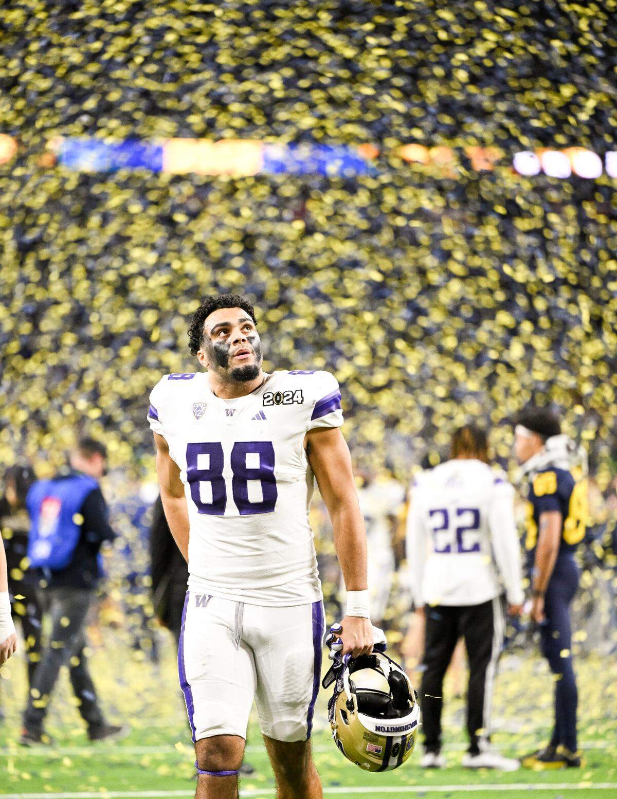 Washington Huskies tight end Quentin Moore (88) walks off the field after Michigan Wolverines 34-13 victory in the College Football Playoff National Championship game at NRG Stadium on Monday, Jan. 8, 2024, in Houston.
