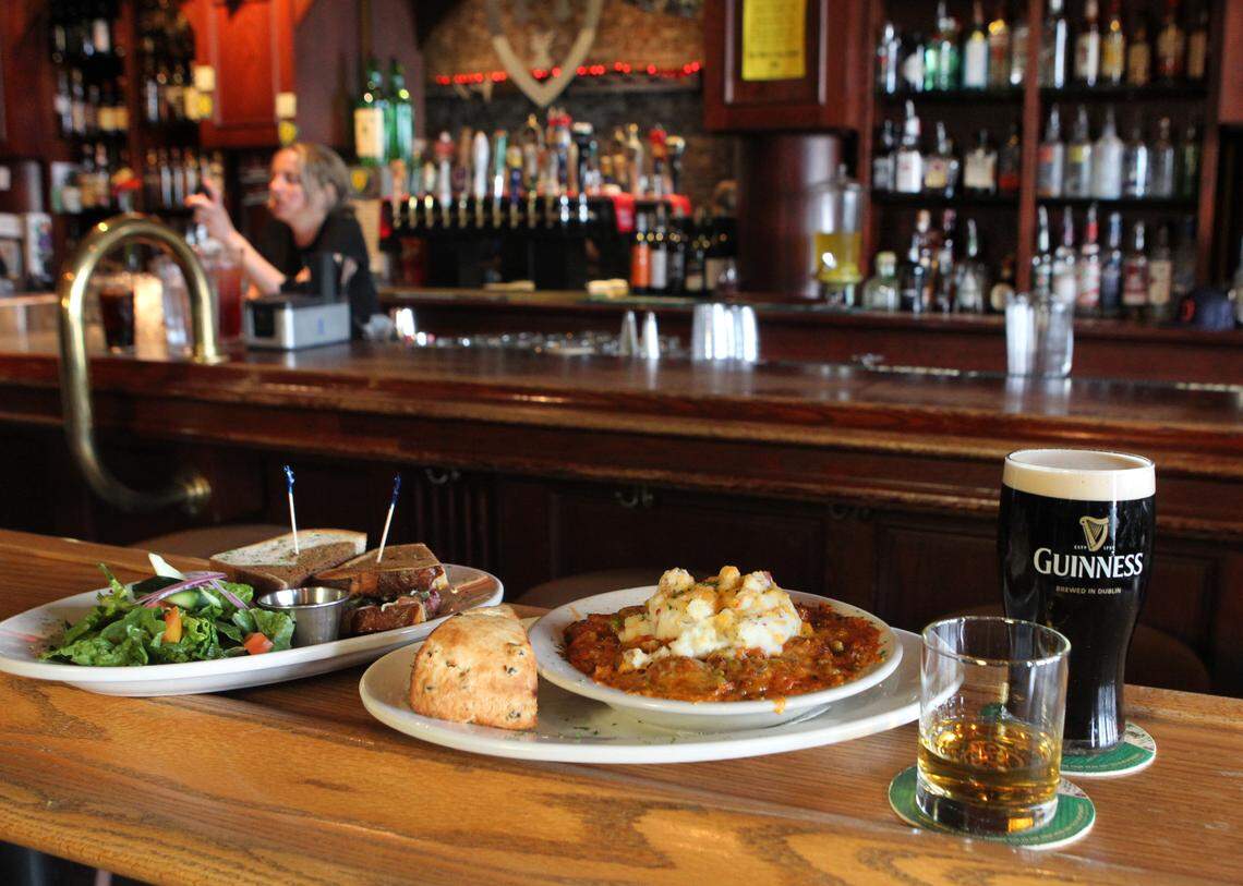 A bevy of Irish food and drink from Doyle’s Public House in Tacoma. From left: corn beef sandwich, shepherd’s pie and soda bread, a shot of Jameson’s whiskey and a pint of Guinness. Photo taken on Monday, March 7, 2011. (DREW PERINE/Staff photographer)