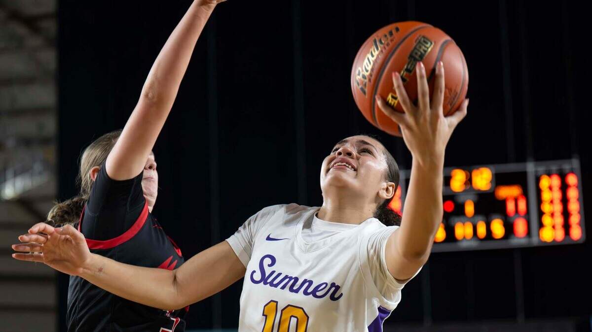 Sumner guard Olivia Collins (10) goes in for a layup as Camas guard Baylie Farra (3) defends during the first half of a Class 4A state basketball tournament quarterfinal game at the Tacoma Dome on Thursday, March 6, 2025, in Tacoma, Wash.