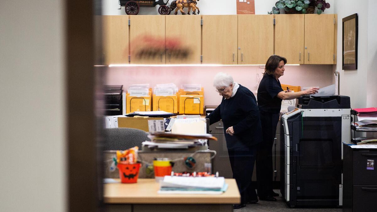 Two police support staffers worked recently on records in the Gig Harbor Police Department. The records section is off-limits to visitors without an escort.