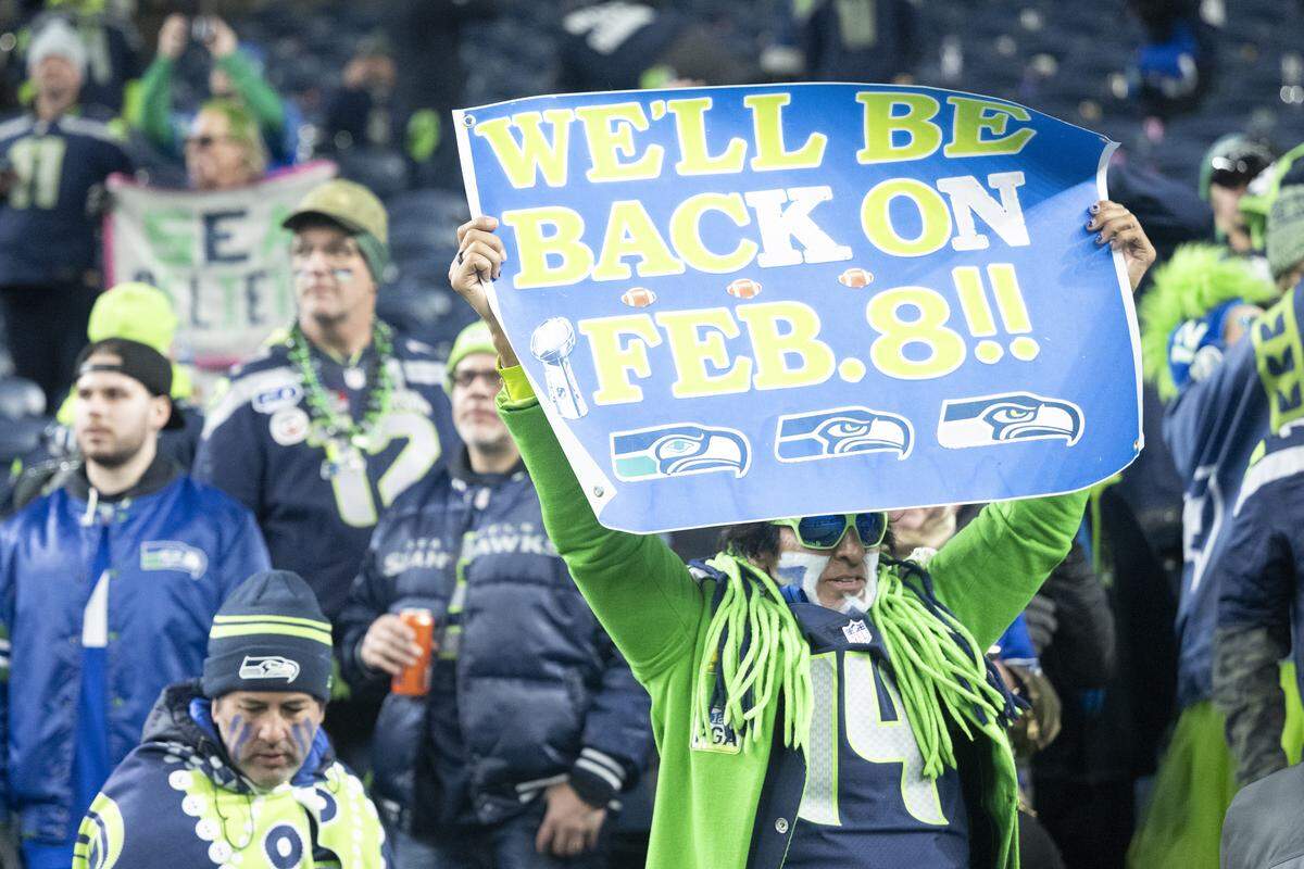 A fan holds a sign after the Seahawks’ win over the Rams for the NFC Championship at Lumen Field, on Sunday, Jan. 25, 2026, in Seattle.