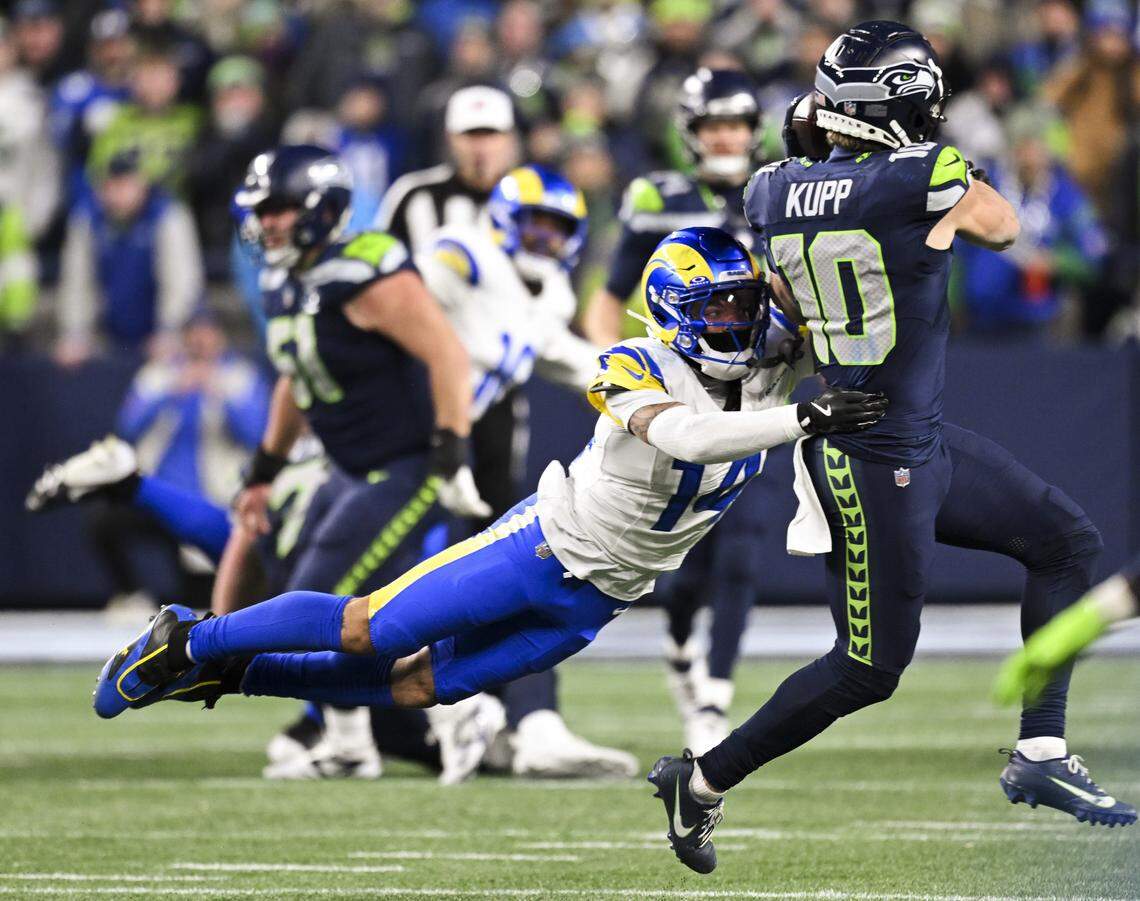 Seattle Seahawks wide receiver Cooper Kupp (10) makes a 7-yard reception to get a new set of downs against Los Angeles Rams cornerback Cobie Durant (14) during the fourth quarter of the NFC Championship game at Lumen Field, on Sunday, Jan. 25, 2026, in Seattle.