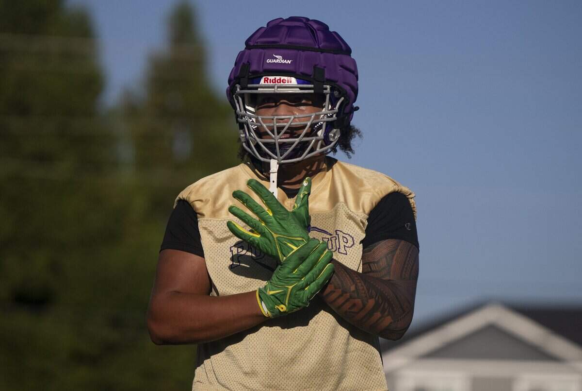 Puyallup offensive lineman Gecova Doyal runs drills during a Puyallup High School football practice at Sparks Stadium on Thursday, Aug. 21, 2025, in Puyallup.
