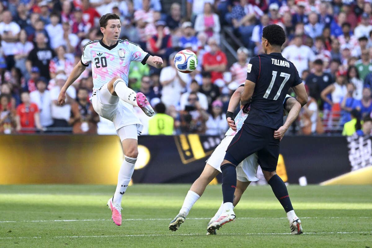 Belgium midfielder Hans Vanaken (20) kicks the ball past United States of America midfielder Malik Tillman (17) during a round of sixteen FIFA World Cup match on Monday, July 6, 2026, in Seattle.