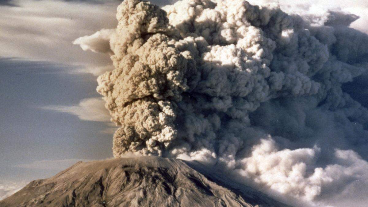 FILE - In this April 1980 file photo, Mount St. Helens spews smoke, soot and ash into the sky in Washington state following a major eruption on May 18, 1980. May 18, 2015 is the 35th anniversary of the eruption that killed more than 50 people and blasted more than 1,300 feet off the mountain’s peak. (AP Photo/Jack Smith, file)