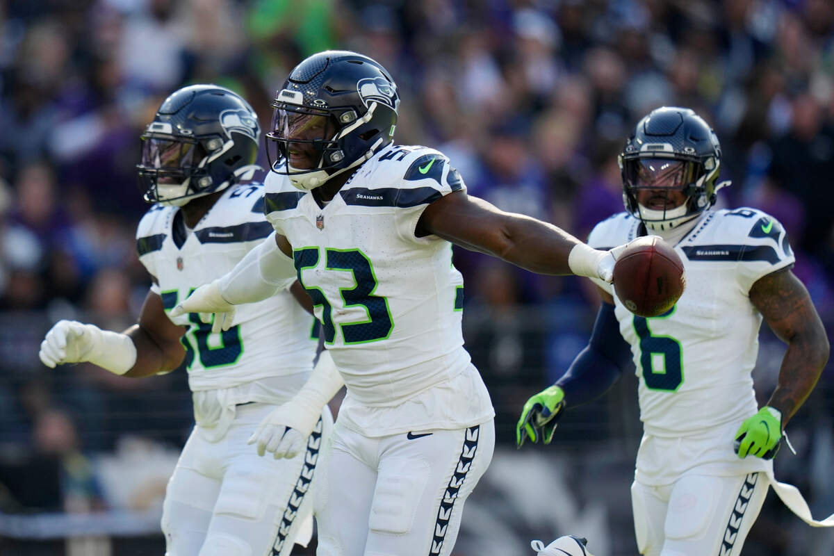 Seattle Seahawks linebacker Boye Mafe (53) celebrates after recovering a fumble during the first half of an NFL football game against the Baltimore Ravens, Sunday, Nov. 5, 2023, in Baltimore. (AP Photo/Alex Brandon)