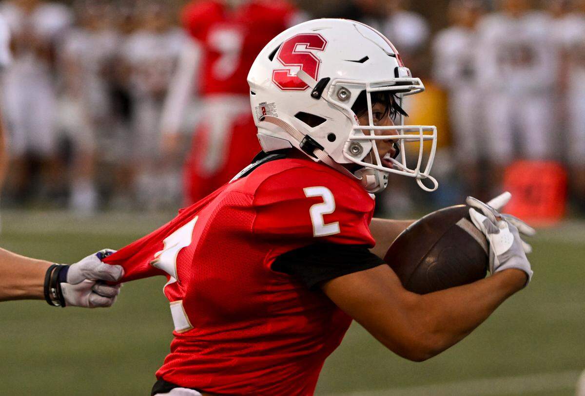 Steilacoom’s Noah Maxwell (2) is held by White River’s Luke Lisherness (23) during the first half of the football game at Steilacoom High School, Thursday, Sept. 7, 2023, Steilacoom, Wash.