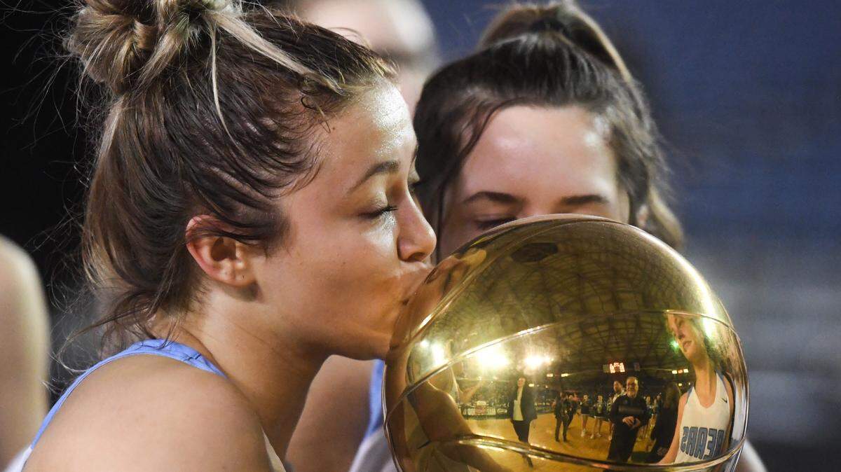 Central Valley’s Peyton Howard kisses the trophy after the game. Woodinville played Central Valley in the 4A girls championship game at the Hardwood Classic state basketball tournament at the Tacoma Dome in Tacoma, Wash., on Saturday, March 7, 2020.