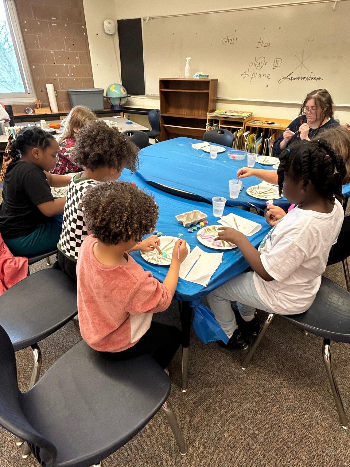 AmeriCorps member Izabel Poole helps students at Franklin Elementary School in Seattle as part of the Girl Scouts of Western Washington in March 2025.