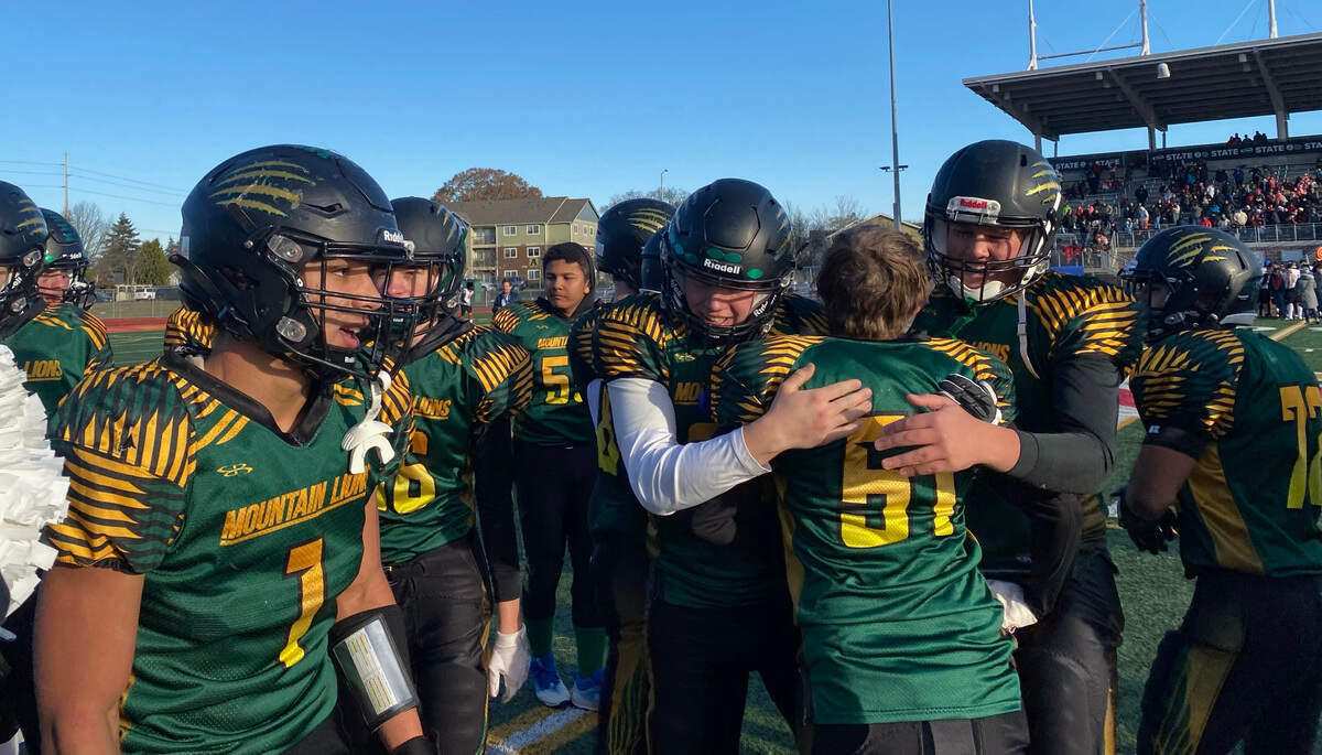 Liberty Bell High School football players celebrate following a 50-12 win over Neah Bay in the Class 1A state championship game on Saturday, Dec. 3, 2022 at Mount Tahoma Stadium in Tacoma, Wash.