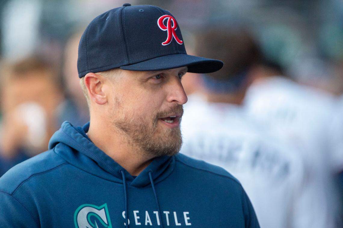 Tacoma Rainiers manager Tim Federowicz talks with players in between innings during the season opener against the Salt Lake Bees at Cheney Stadium in Tacoma, Wash., Tuesday, April 5, 2022.