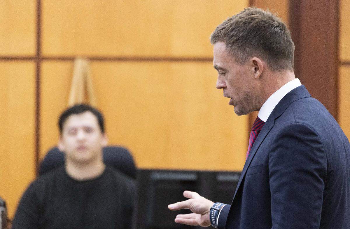 Defense attorney Casey Arbenz, right, cross examines Seth Cowden, a witness who filmed a video of the beating and killing of Manny Ellis on March 3, 2020, in Pierce County Superior Court in Tacoma, Wednesday, October 18, 2023. Tacoma Police Officers Christopher Burbank, Matthew Collins and Timothy Rankine are on trial for his death. (Ellen M. Banner / Pool / The Seattle Times)