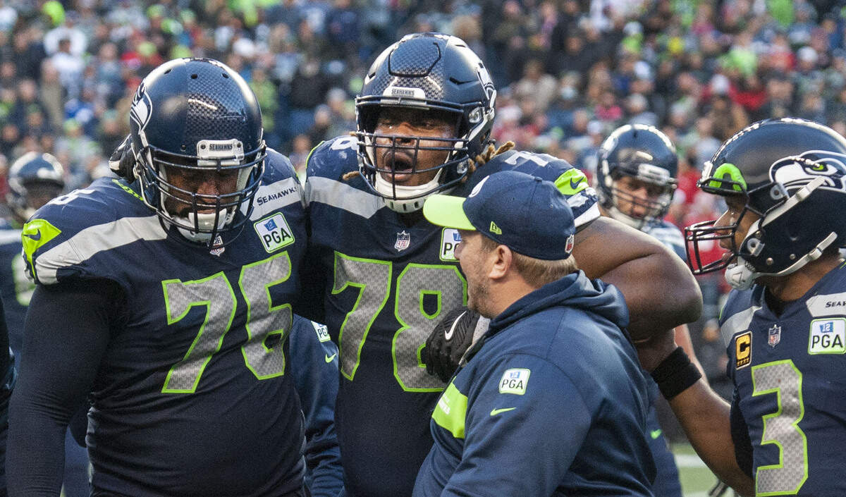 Seahawks guard D.J.  Fluker (#78) exhales in pain as he’s helped off the field by fellow lineman Duane Brown. The Seattle Seahawks played the San Francisco 49ers  in a NFL football game at CenturyLink Field in Seattle, Wash., on Sunday, Dec. 2, 2018.
