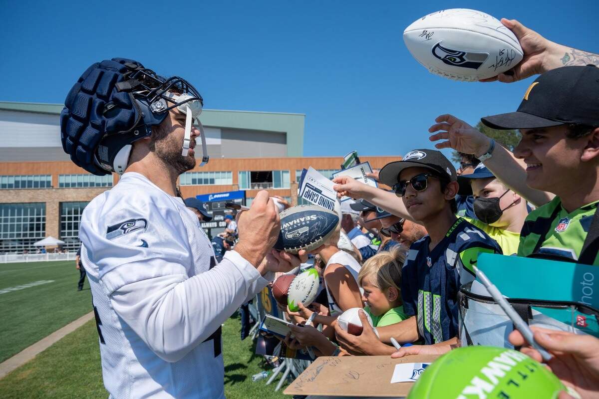 Seattle Seahawks Nick Bellore meets with fans after the second training camp practice for the Seahawks at the Virginia Mason Athletic Center in Renton, Wash. on July 28, 2022.