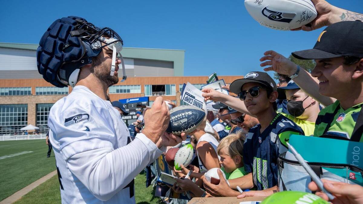 Seattle Seahawks Nick Bellore meets with fans after the second training camp practice for the Seahawks at the Virginia Mason Athletic Center in Renton, Wash. on July 28, 2022.