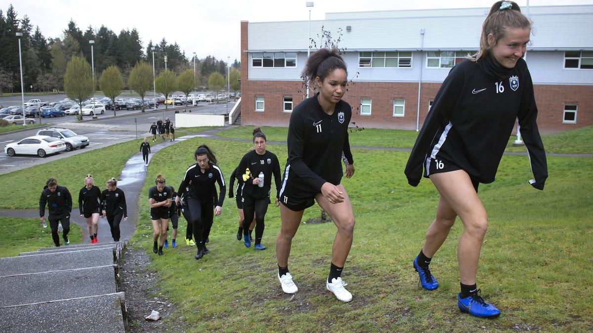 Reign FC players arrive at Foss High School in Tacoma for soccer practice on Tuesday, April 9, 2019.