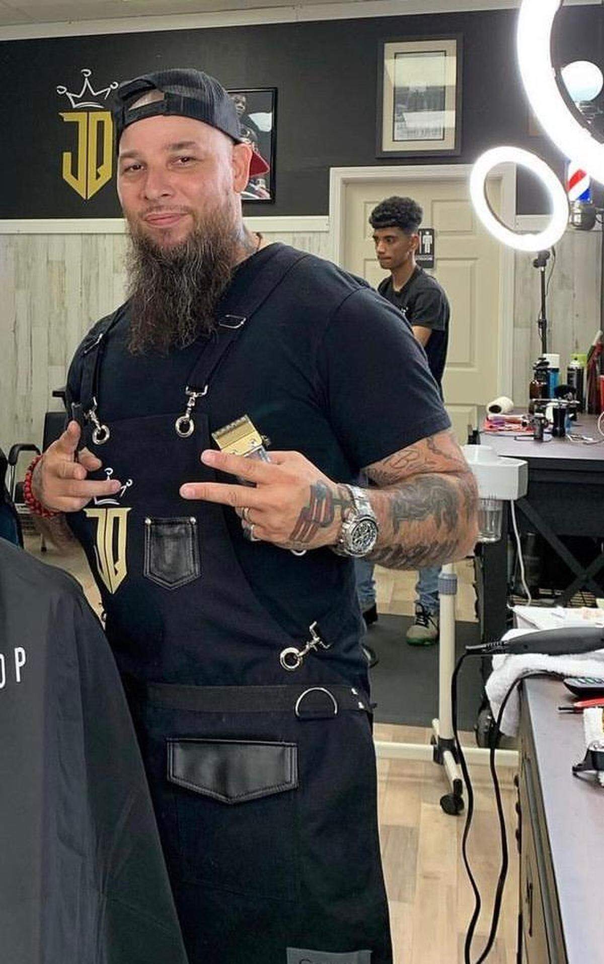 Jose Velez, 43, works in JQ’s Barbershop, located at 112 E. Stewart Ave. in Puyallup in an undated photo. Velez was fatally shot Wednesday while he worked at the shop.