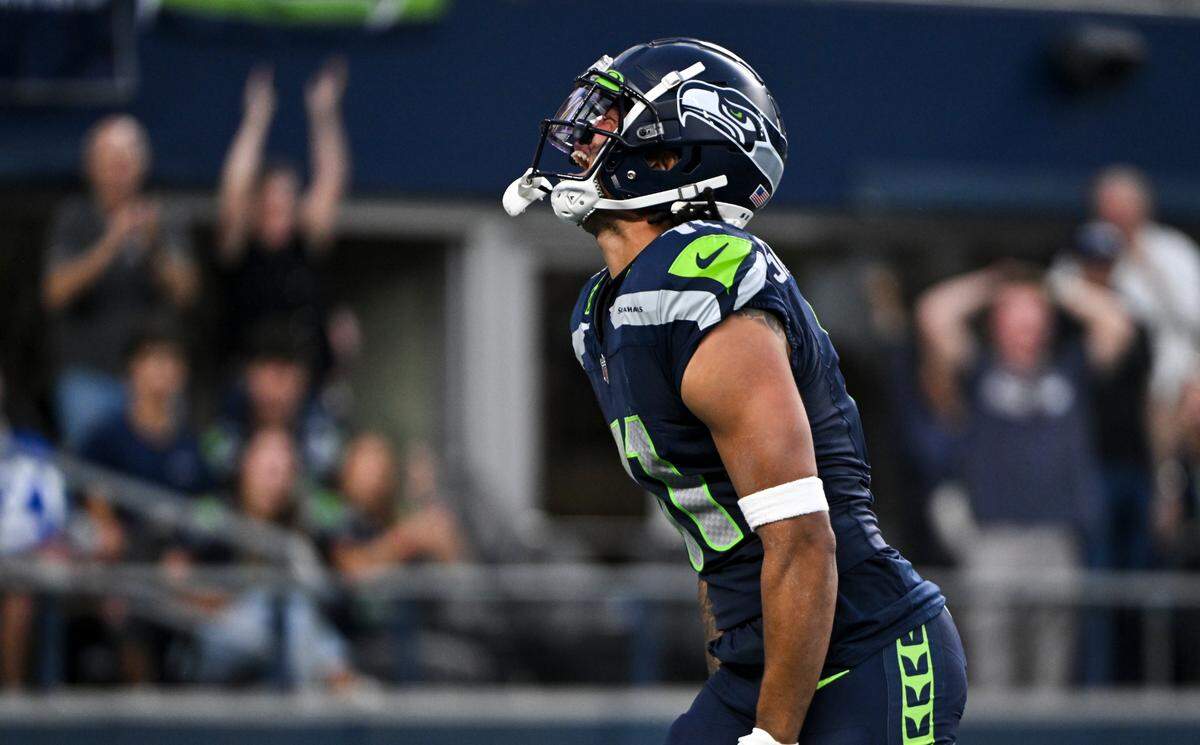 Seattle Seahawks wide receiver Jaxon Smith-Njigba (11) reacts to a reception that landed the Seahawks at the goal line against the Dallas Cowboys during the second quarter of the preseason game at Lumen Field, Saturday, Aug. 19, 2023, in Seattle.