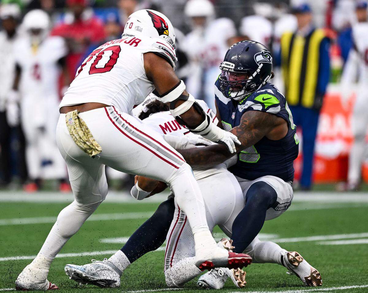 Seattle Seahawks defensive end Leonard Williams (99) sacks Arizona Cardinals quarterback Kyler Murray (1) during the third quarter of the game at Lumen Field, on Sunday, Nov. 24, 2024, in Seattle, Wash.