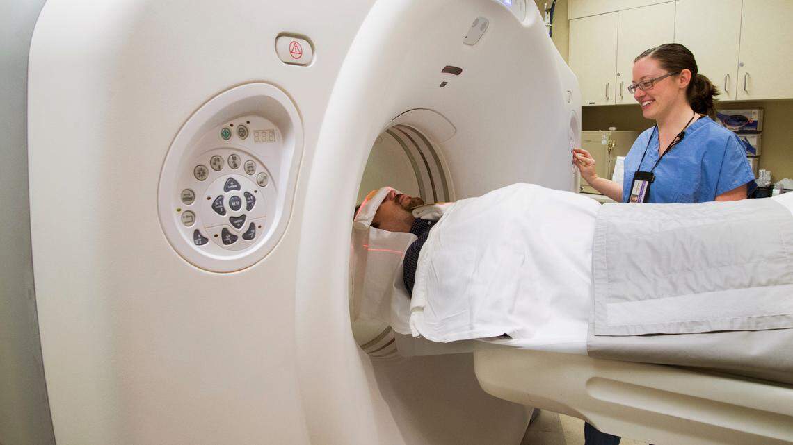 Imaging technologist and patient during a CT scan at Radiology/Imaging Services at UWMC-Roosevelt in Seattle.