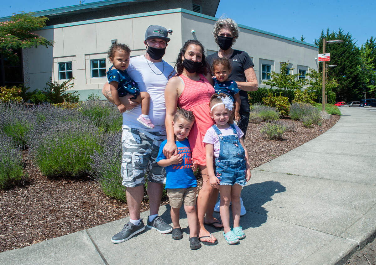 Barbara Curtis Maefau, center, was able to overcome depression and past trauma to reunite with her children after participating in Pierce County Baby Court. From left: her husband Kyle Bannister and children, Lena, Leelynn, Puka, Sophia and aunt Shirley Hart.