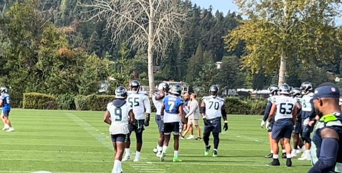 Lead running back Kenneth Walker (9) at the Virginia Mason Athletic Center in Renton returning from an oblique injury to rejoin quarterback Geno Smith (7) and the starting offense at the start of practice Thursday, Sept. 26, 2024, for the Seahawks’ game at the Detroit Lions four days later.