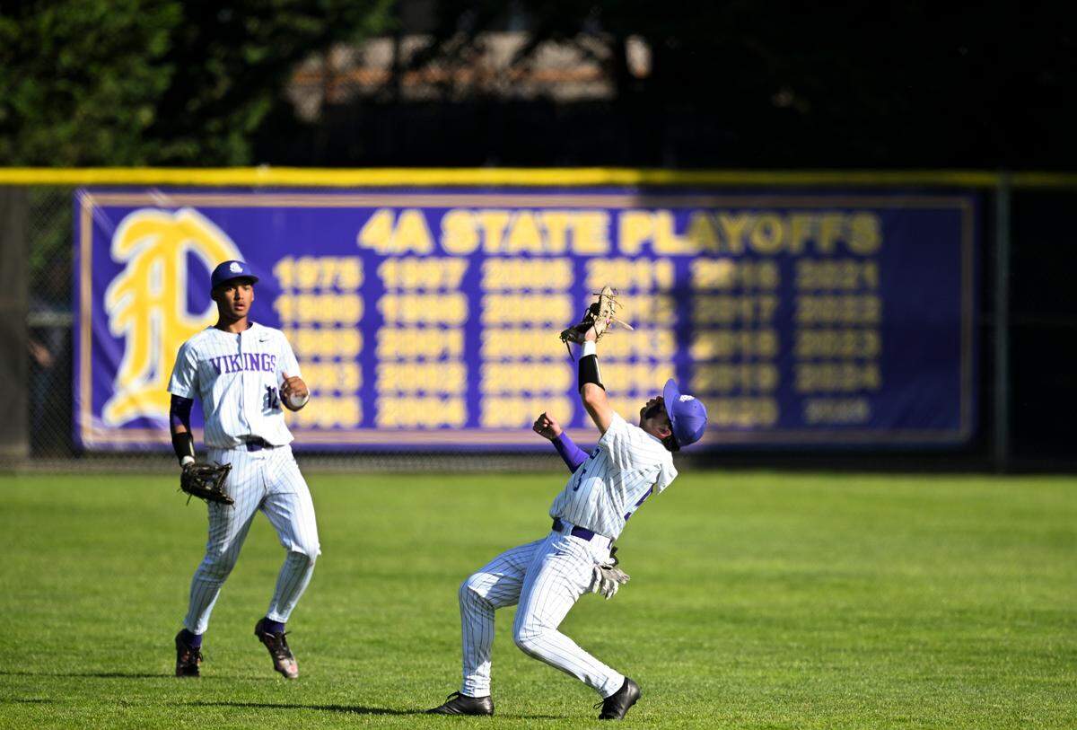 Puyallup’s Brayden Landry (5) catches a fly ball against Lake Stevens during the quarterfinal round of the 4A State tournament at Heritage Recreation Center, on Saturday, May 24, 2025, in Puyallup, Wash. 