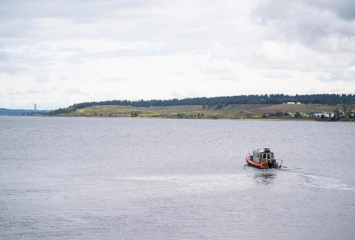 McNeil Island Fire Department Captain Aaron MacLean drives a boat that he and other firefighters used to rescue two brothers from their sailboat that was stranded in the Puget Sound, on Friday, May 27, 2022 in Steilacoom, Wash.