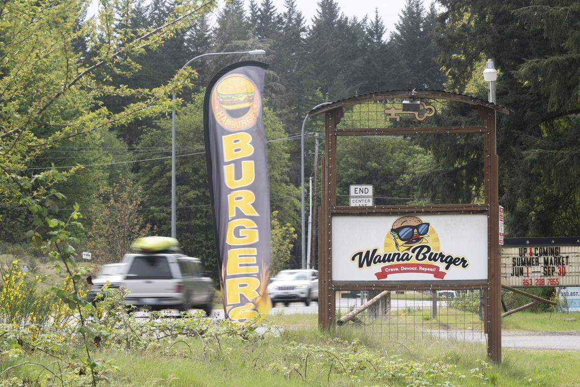 Cars move past the entrance to Wauna Burger along State Route 302 on Tuesday, April 28, 2026, in Gig Harbor, Wash.