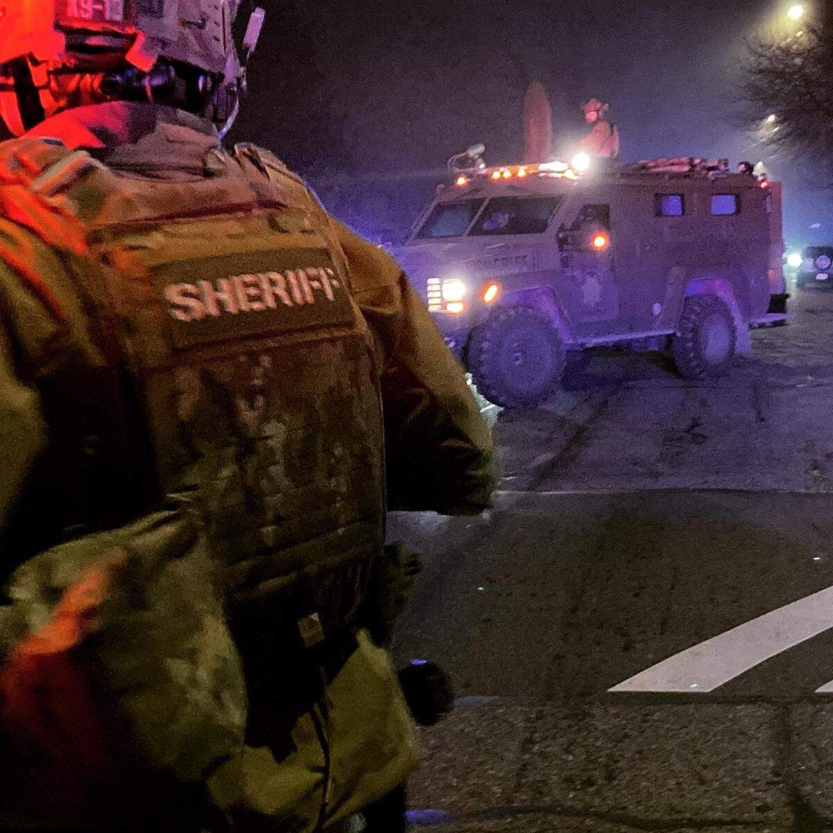 A SWAT team from Pierce County Sheriff’s Department makes an arrest Wednesday morning at a residence south of Tacoma near Parkland. Deputies said a 32-year-old man suspected in a fatal hit-and-run in Midland was arrested without incident.