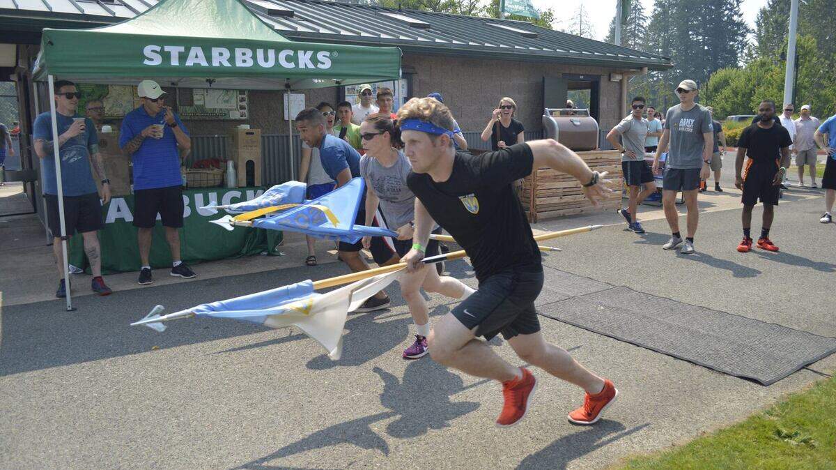 Local military, police and firefighters take part in a relay race during the 2017 Military Appreciation Day Picnic in Gig Harbor.