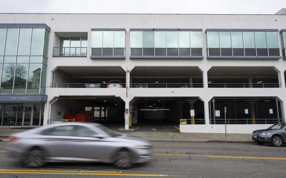 Cars move past a parking garage and office site for Virginia Mason Franciscan Health along Market Street on Friday, Feb. 27, 2026, in Tacoma, Wash.