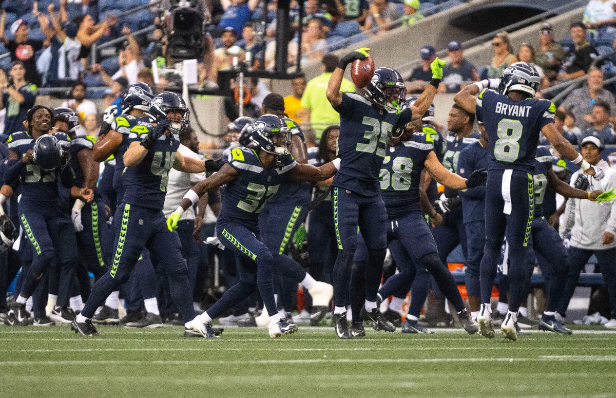 Seattle Seahawks safety Joey Blount (35) jumps and celebrates after recovering an onside kick late in the Seahawks’ second preseason game at Lumen Field in Seattle on August 18, 2022.
