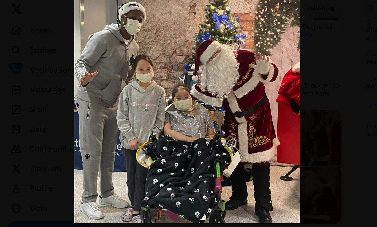 Quarterback Geno Smith (far left) visited with patients at Seattle Children’s hospital on Dec. 19, 2023, the day after Smith’s Seahawks beat the Philadelphia Eagles.