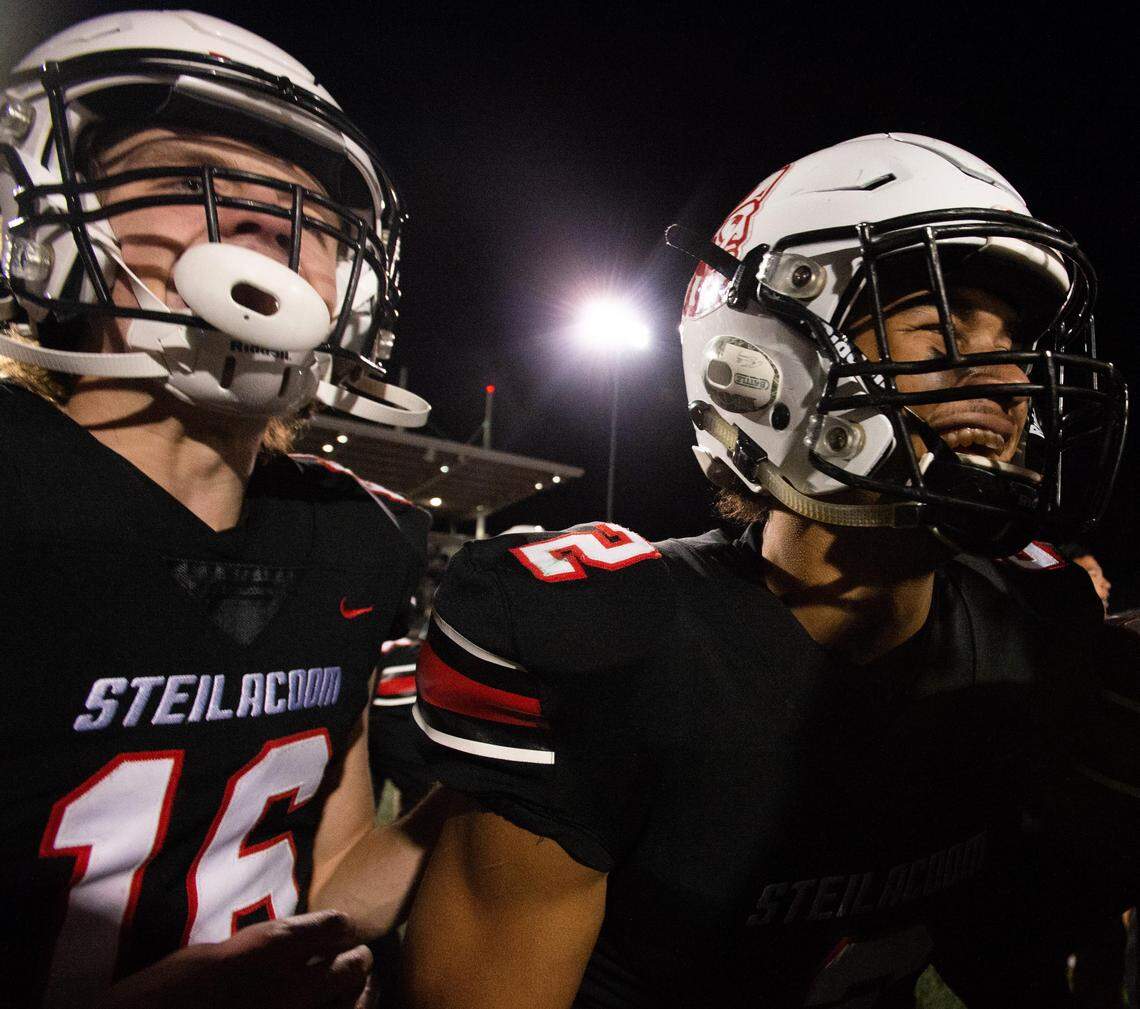 Steilacoom’s Cole Miller, left, and Emeka Egbuka, right, celebrate after beating Lynden in the 2A state semifinal game at Mount Tahoma High School in Tacoma, Wash., on Saturday, Nov. 30, 2019.